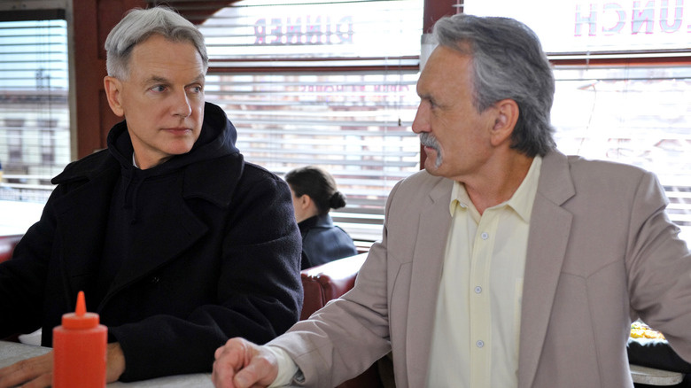 Leroy Jethro Gibbs and Mike Franks sitting next to each other at a diner