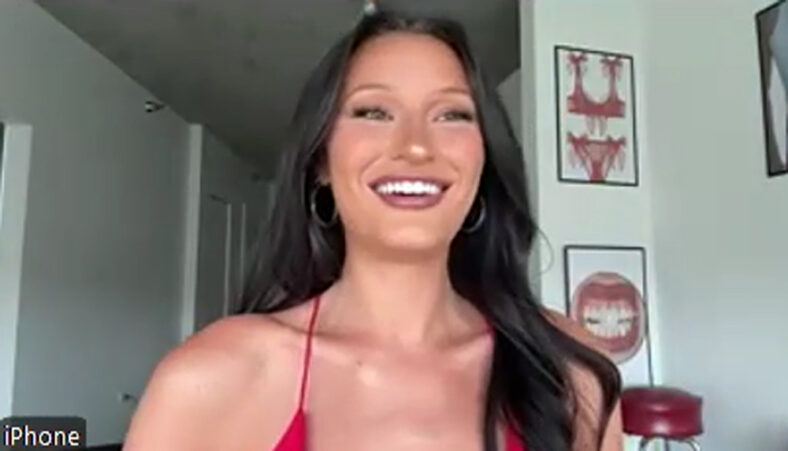 Screen Grab of Ashley Trail smiling in a home