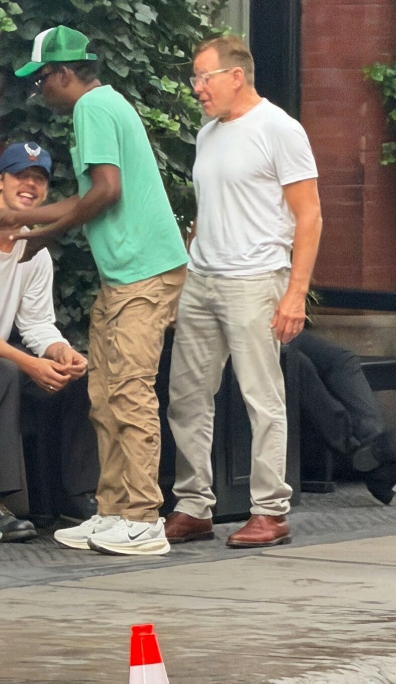 Austin Butler smiling at Chris Rock