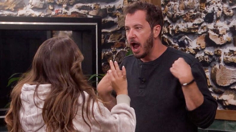 Rick Devens looking shocked while Dee tries to calm him down during Big Brother moment