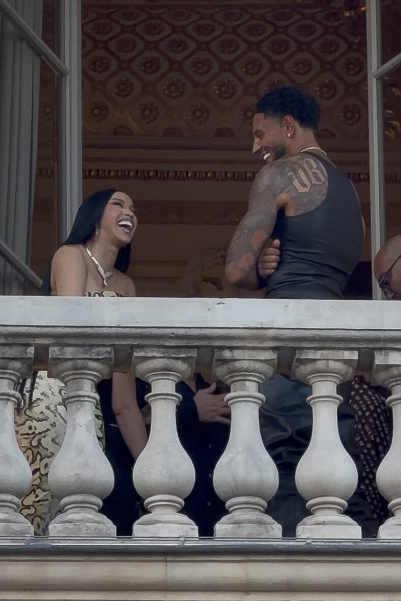 Cardi B and Maduka Okoye share a laugh on a balcony in Paris