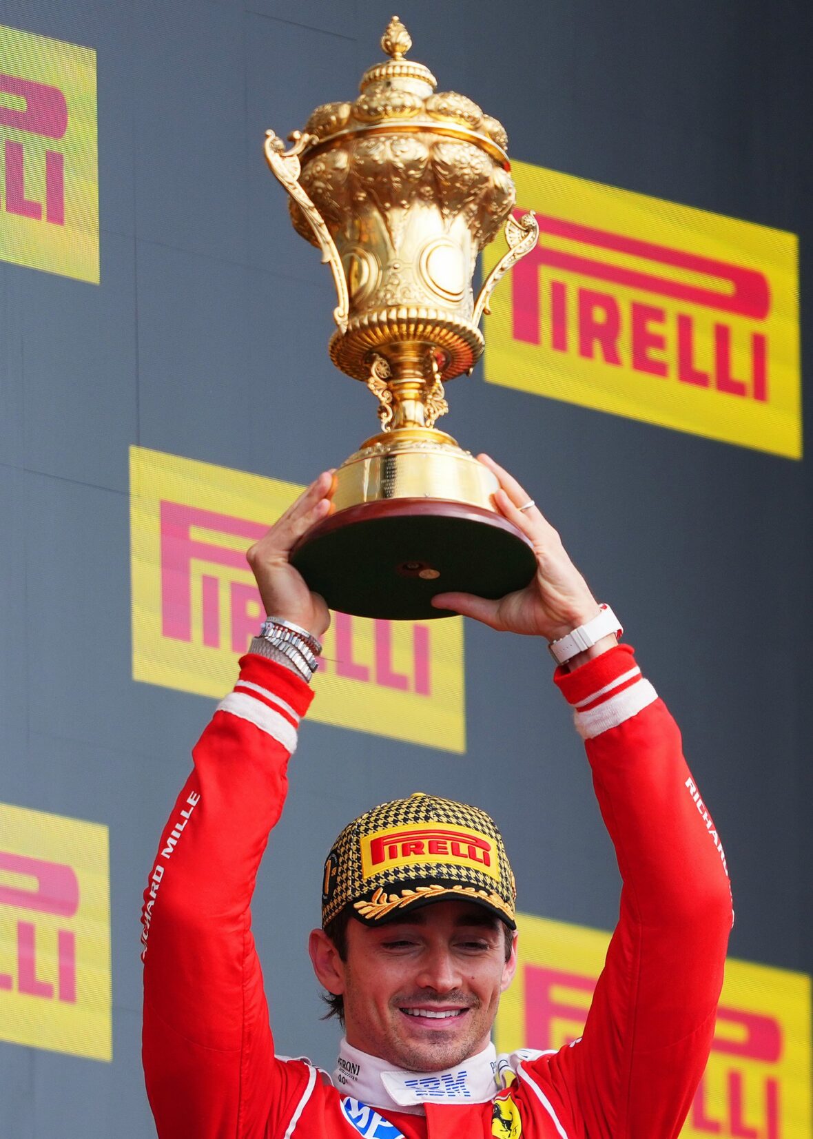 Charles Leclerc holds his first-place trophy at the British Grand Prix