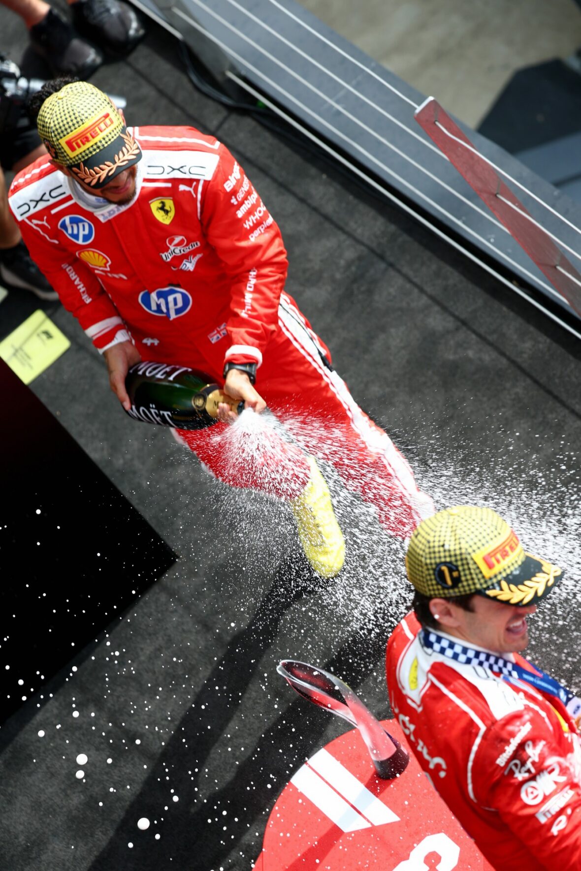 Charles Leclerc and Lewis Hamilton celebrate after British Grand Prix