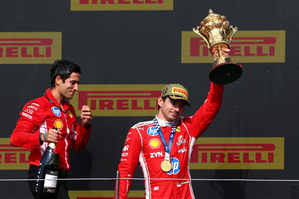 Charles Leclerc holds his first-place trophy at the British Grand Prix