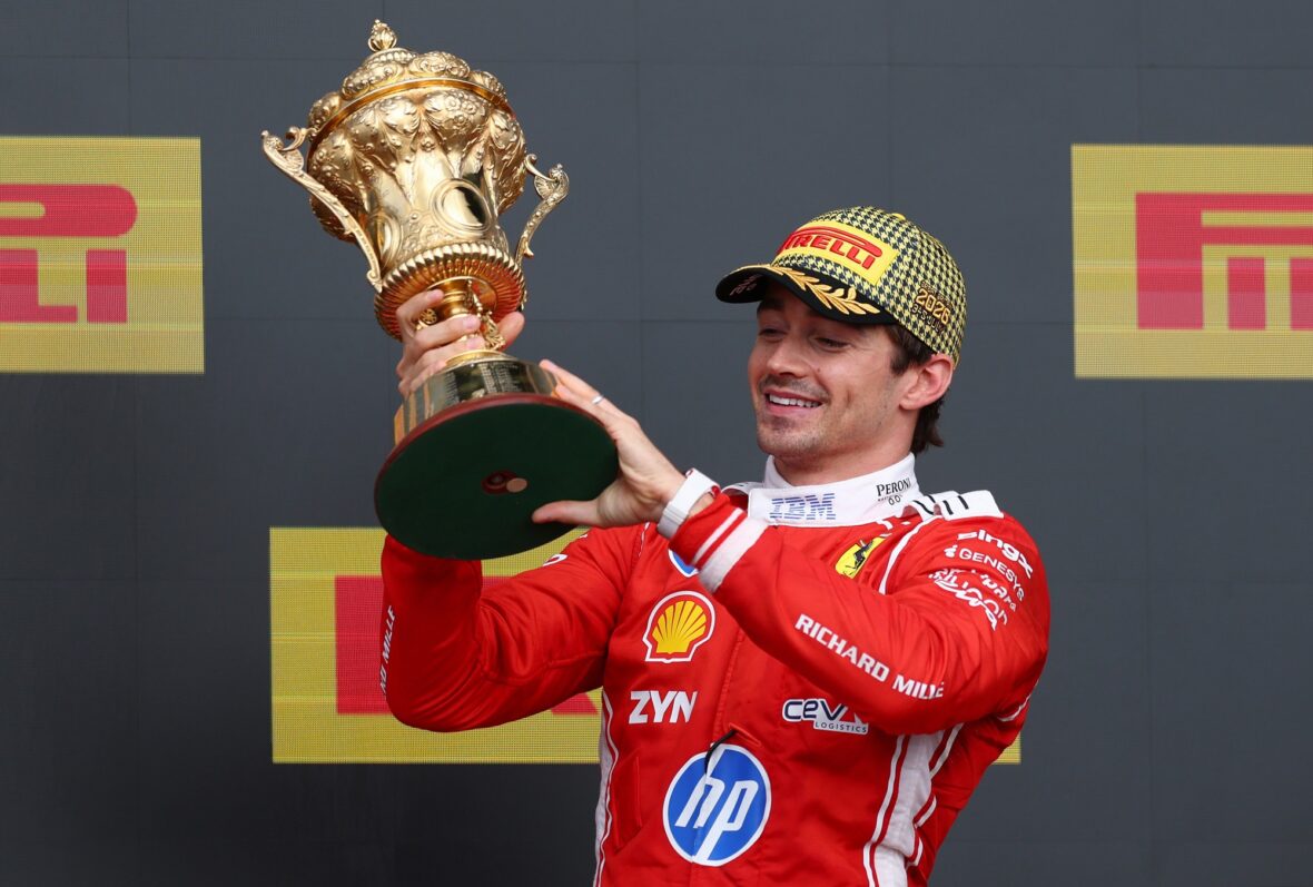 Charles Leclerc holds his first-place trophy at the British Grand Prix