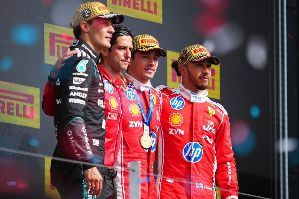 George Russell, Bryan Bozzi, Charles Leclerc and Lewis Hamilton on the podium after the British Grand Prix