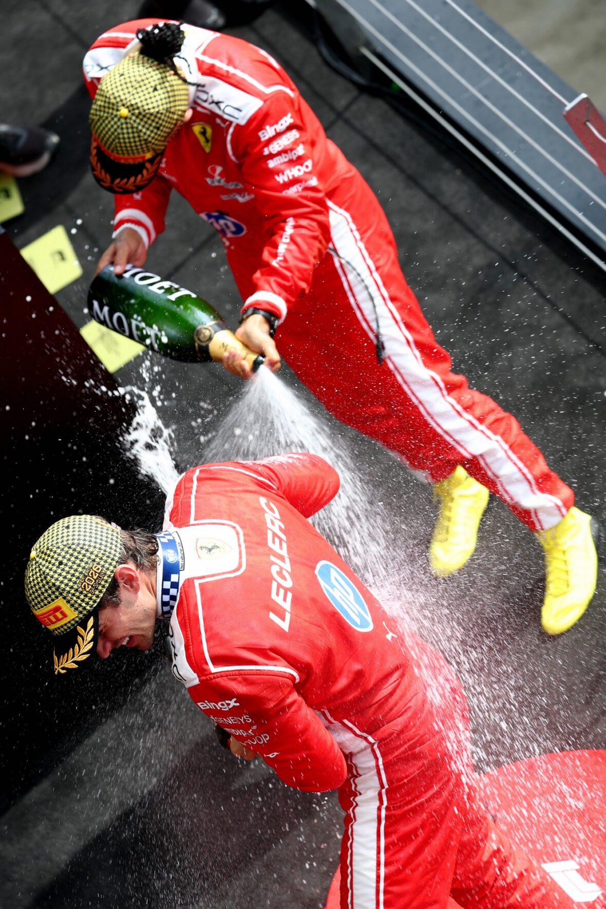 Charles Leclerc and Lewis Hamilton celebrate after British Grand Prix