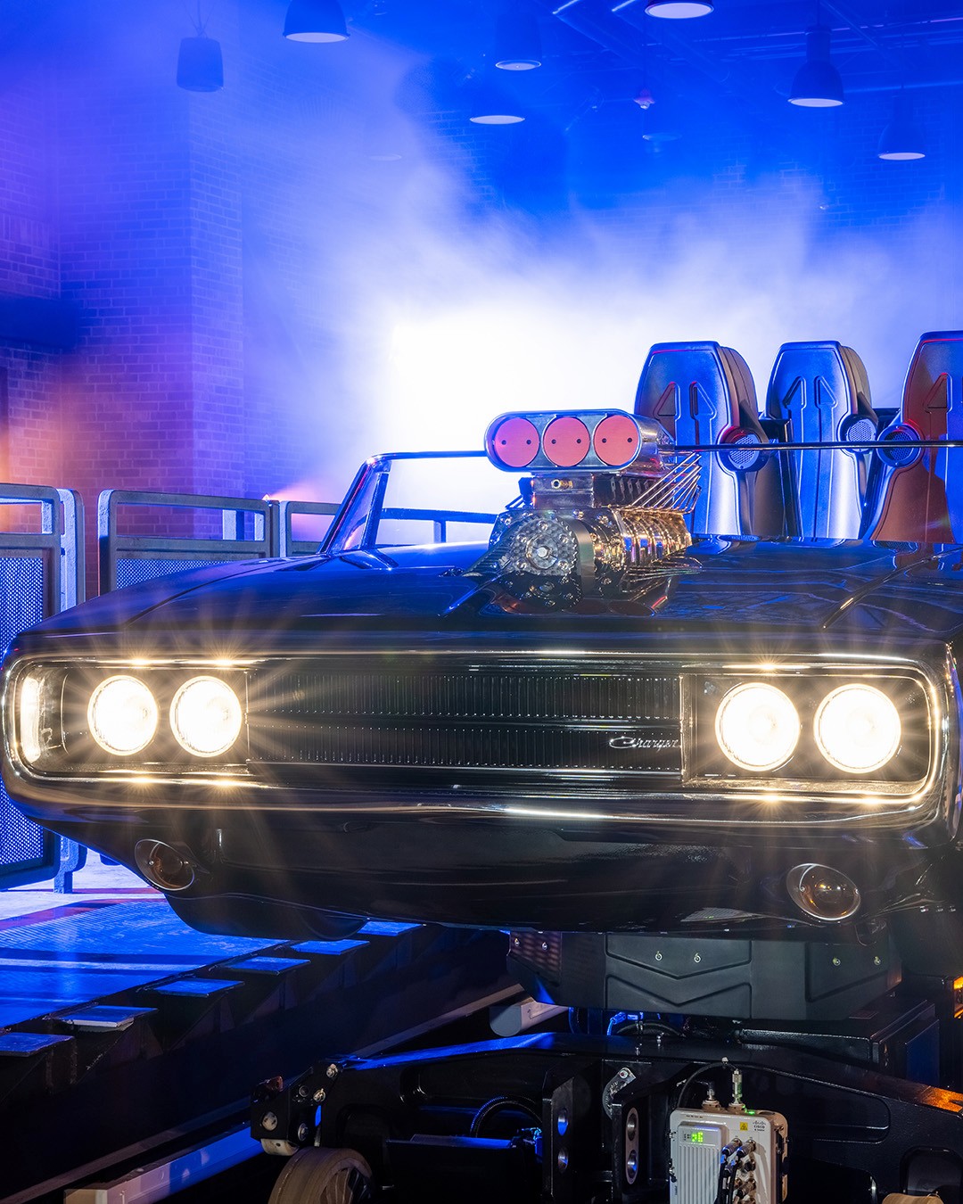 Photo of the Fast & Furious: Hollywood Drift ride vehicles in the loading bay
