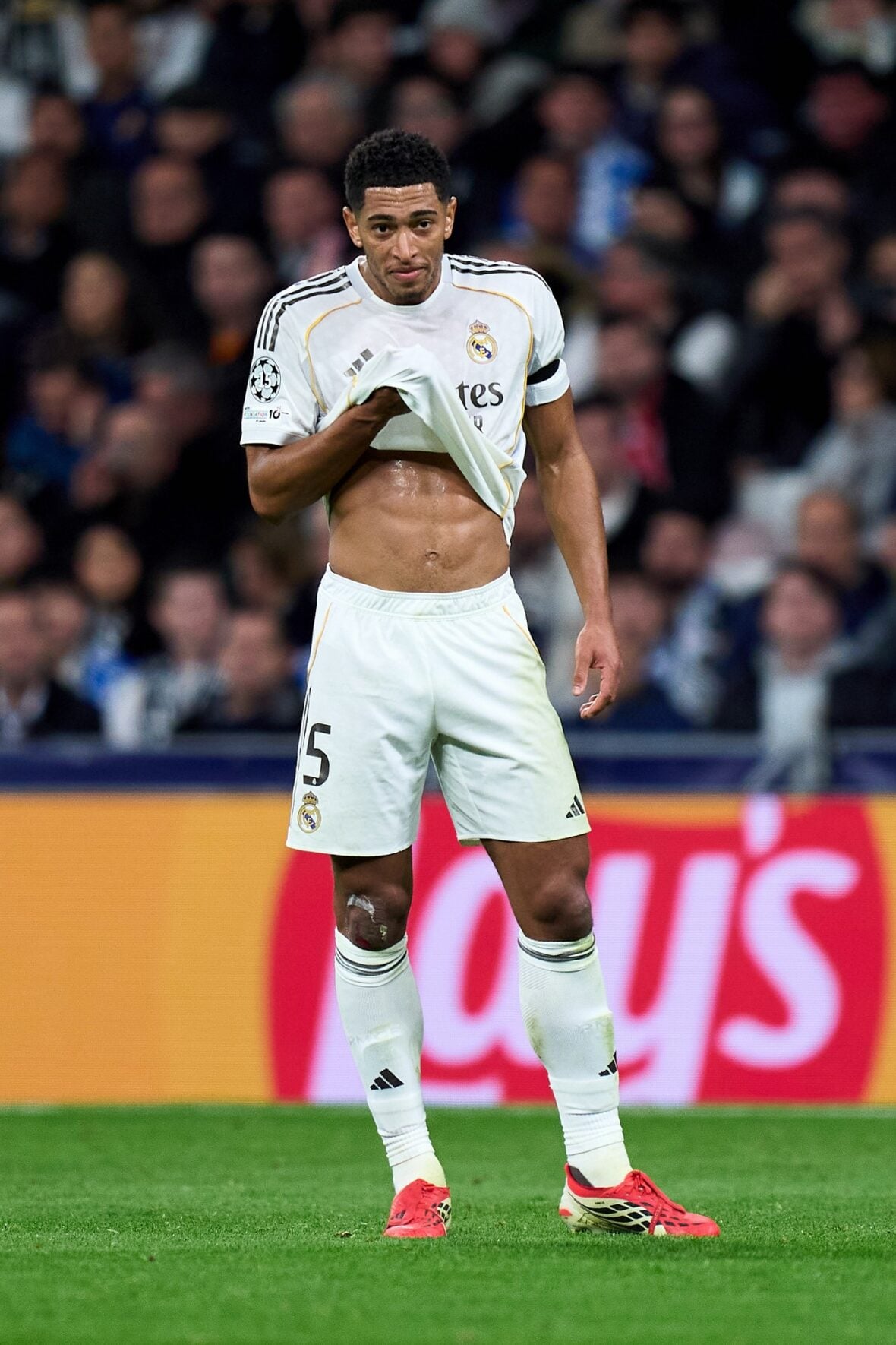 Jude Bellingham flashes his abs during a soccer match