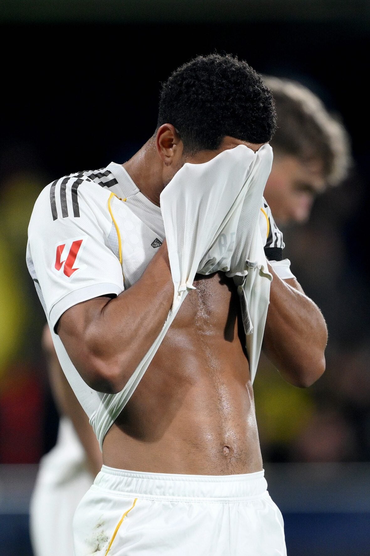 Jude Bellingham flashes his abs during a soccer match