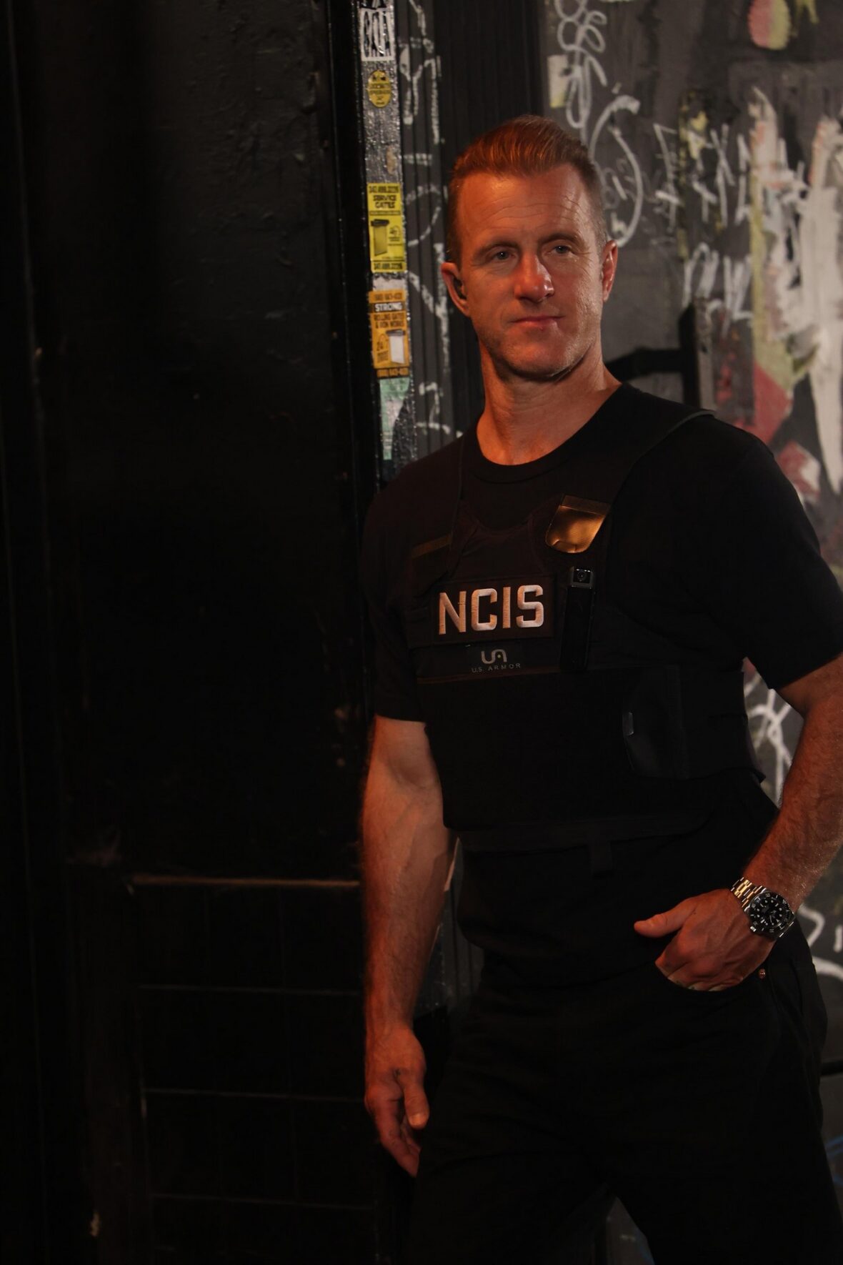 Scott Caan wearing an NCIS vest for 'NCIS: New York'