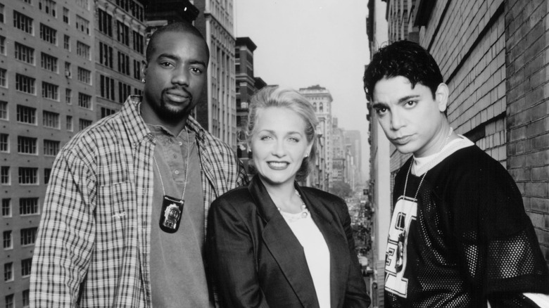 Malik Yoba, Patti D'Arbanville and Michael DeLorenzo on an NYC balcony in an official black and white promo image for New York Undercover.