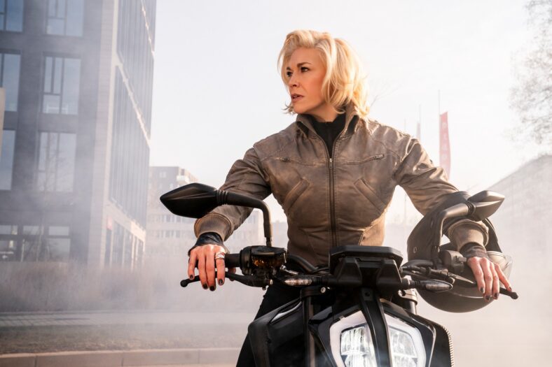 Hannah Waddingham riding a motorcycle in Ride or Die still.