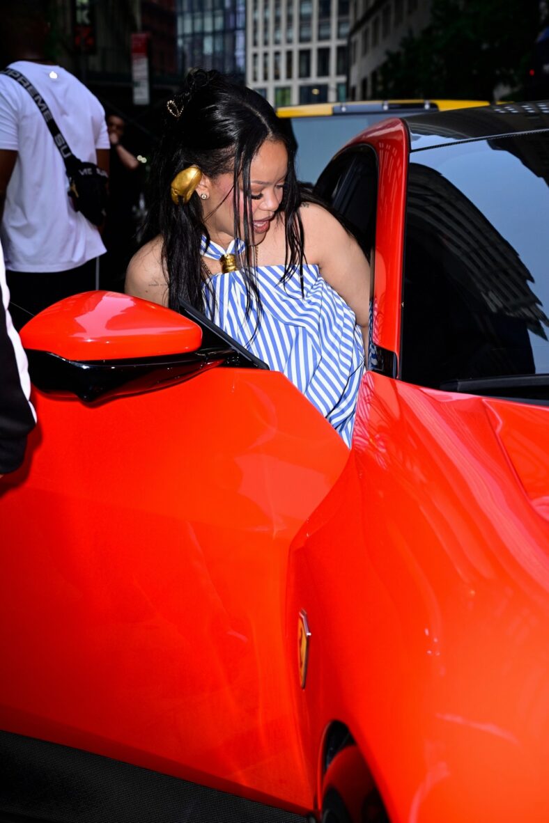 Rihanna gets into the passenger seat of a car while out in NYC