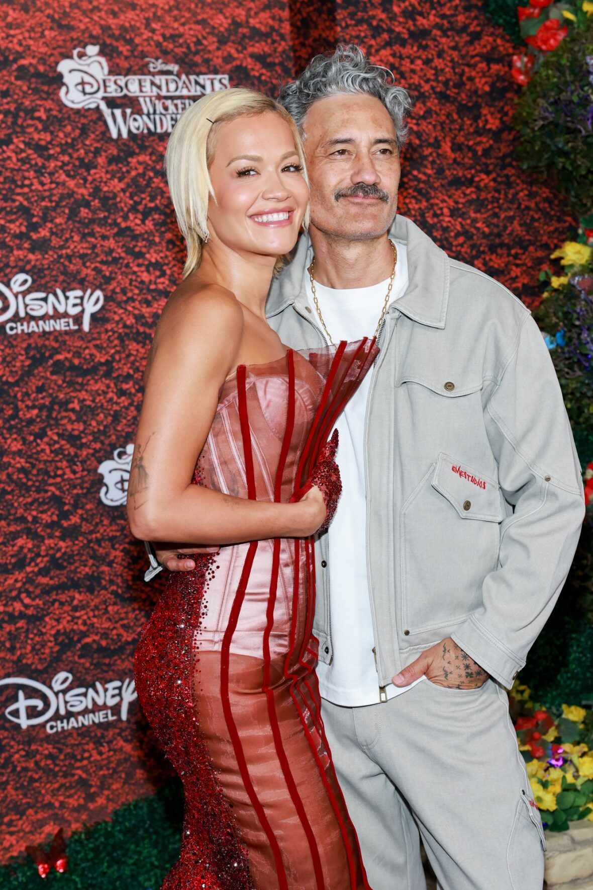 Taika Waititi and Rita Ora pose at the Descendants: Wicked Wonderland premiere