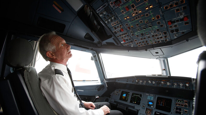 Sully Sullenberger stock photo of him in an airplane cockpit