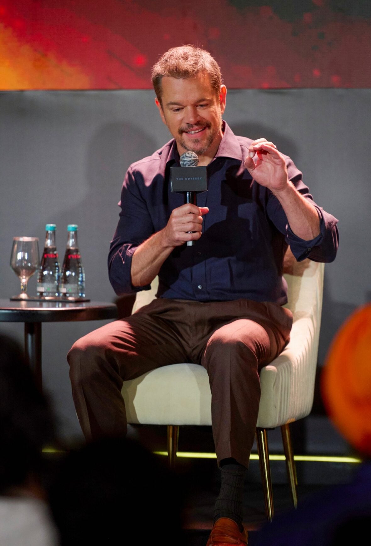 Matt Damon speaks on stage at a Mumbai press conference for The Odyssey