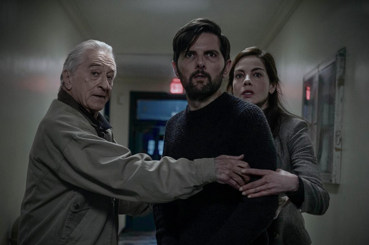 Robert De Niro and Michelle Monaghan flank Adam Scott in a still from