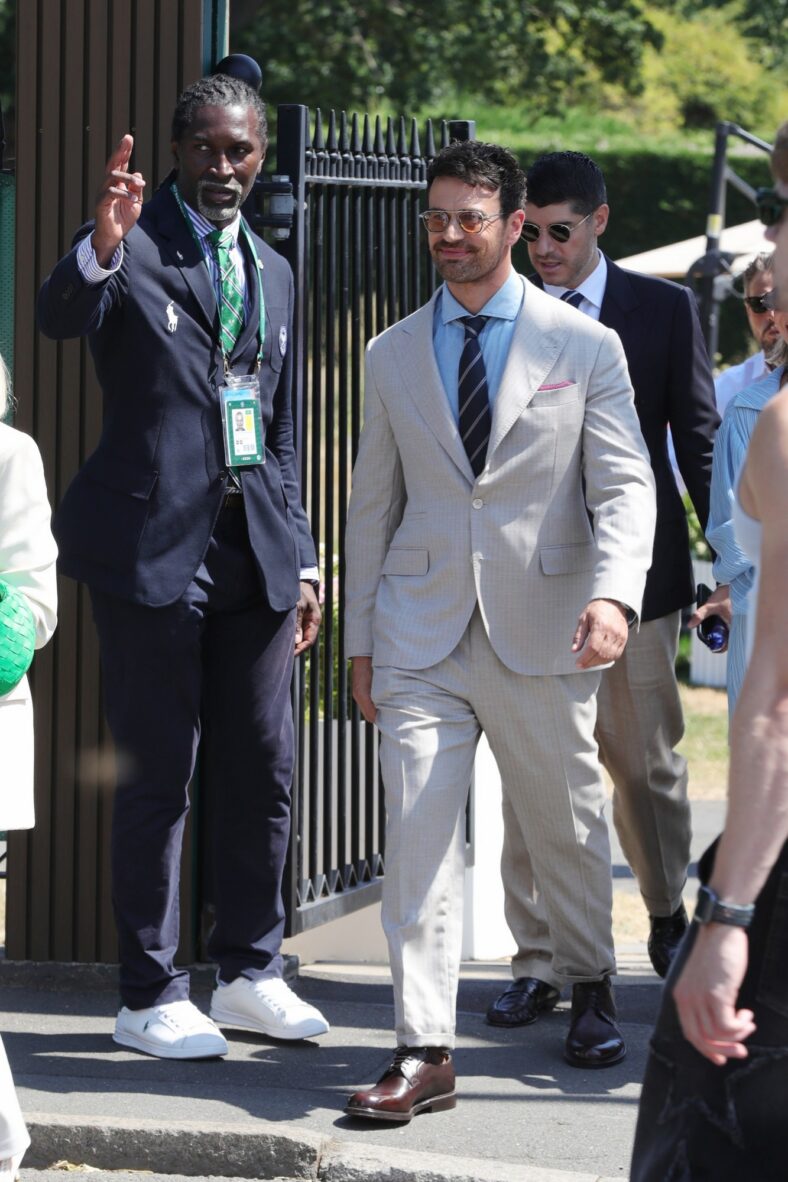 Theo James gets directions while arriving at Wimbledon