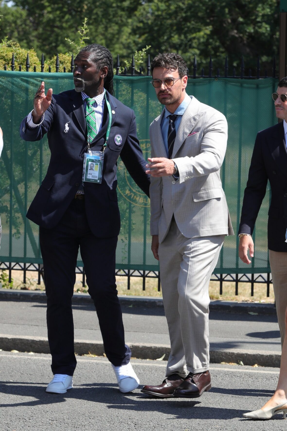 Theo James gets directions while arriving at Wimbledon