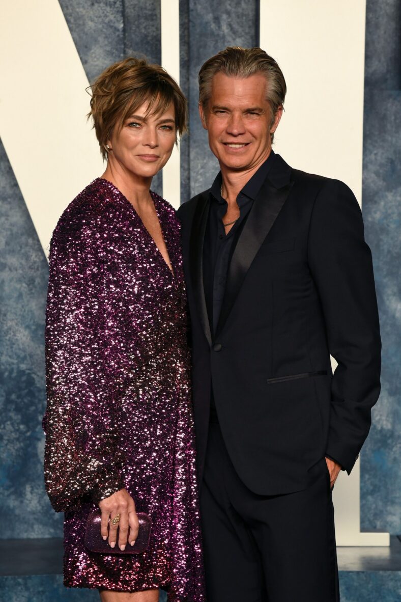 Timothy Olyphant and wife Alexis Knief pose for a photo together at a formal event.