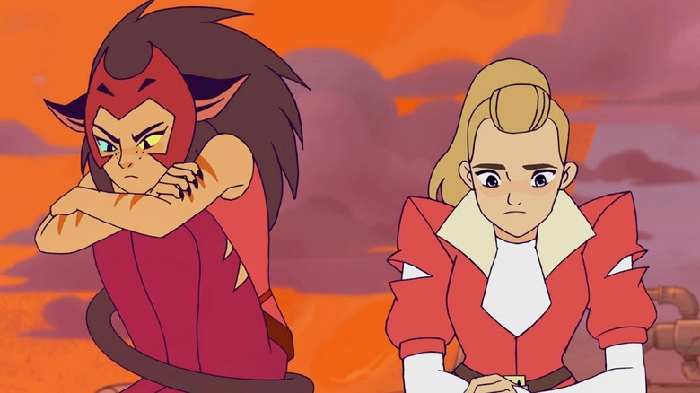 Catra and Adora looking frustrated against an orange sky in She-Ra and the Princesses of Power (2018)